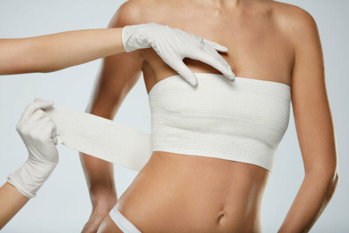 woman with gauze bandage around breast