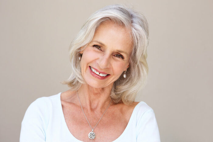 mature woman with no wrinkles on forehead